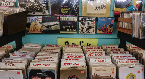 A row of vinyl records that someone is planning to ship through the vinyl record postal service